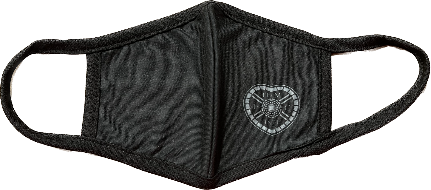 Black Face Covering With White Crest